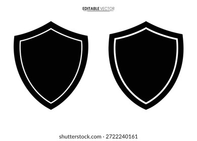 Un par de escudos negros, delineados en blanco, muestran un diseño clásico de emblema protector.