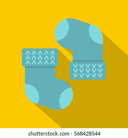 Pair of blue baby socks icon. Flat illustration of pair of blue baby socks vector icon for web on yellow background