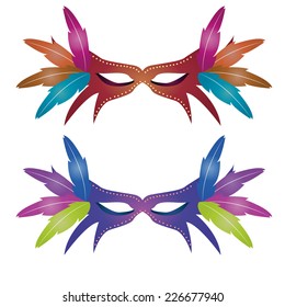 a pair of carnival masks on a white background