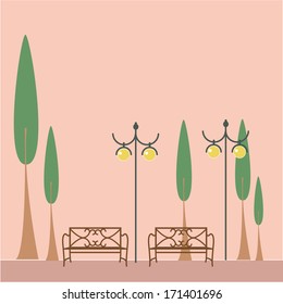 a pair of chairs and lamps in a park