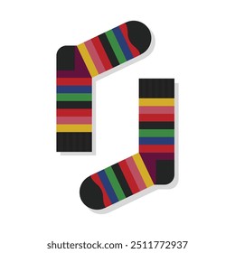 A pair of cute and funky isolated neat and clean colorful stripy socks on white background - with top view opposite layout close up 