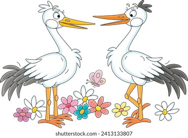 Pair of cute white storks chatting happily and walking among colorful summer flowers, vector cartoon illustration isolated on a white background