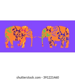 A pair of elephants , decorated with floral ornaments