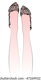 a pair of feet clad in ballet flats