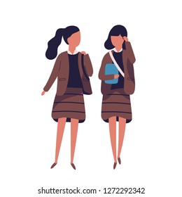 Pair of girls dressed in school uniform. Female students, pupils, classmates, schoolfellows walking together and talking to each other or chatting. Colored vector illustration in modern flat style.