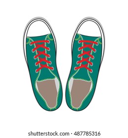 Pair of green gumshoes. Teenage school street wear. Top view sneakers.