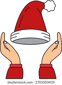 Um par de mãos segurando um chapéu de Papai Noel
