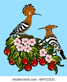 A pair of hoopoes on a cherry blossom branch