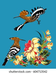 A pair of hoopoes in thickets of wildflowers