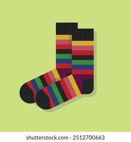 A pair of kids funky isolated neat and clean colorful stripy side by side socks on green background - with top view layout close up 