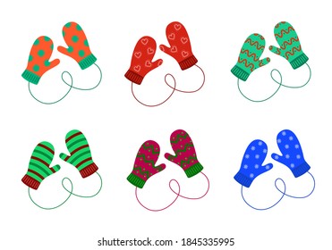 Pair of knitted mittens set. Woolen christmas mittens with different patterns isolated on the white background. Vector illustration.