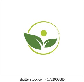 a pair of leaf with abstract head inside a circle vector icon design template for wellness treatment, yoga beauty center, and green organic dietary logo