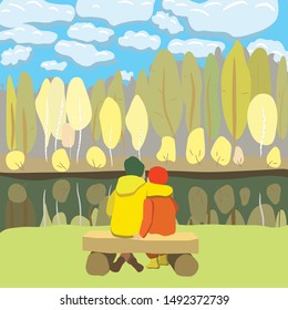 The pair man and woman on the bench on the background of autumn forest and lake