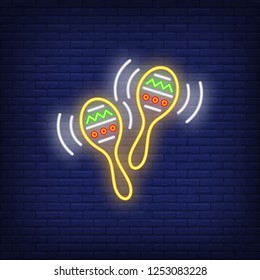 Pair of maracases neon sign. Mexican culture design. Night bright neon sign, colorful billboard, light banner. Vector illustration in neon style.
