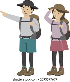 A pair of men and women hiking and climbing overlooking a man pointing a finger