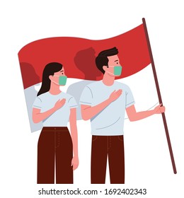 A pair of men and women wearing masks put their hands on their chests while holding the Indonesian flag to show solidarity in the middle of coronavirus pandemic.
