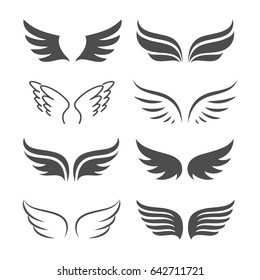 Pair of monochrome wings vector icon set. The concept of freedom or flight. Abstract silhouettes of wings isolated on white background. 