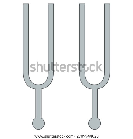 A pair of oversized tuning forks presented against a plain background. Ideal for stock imagery related to music, sound therapy, vibration, acoustics, and educational demonstrations.