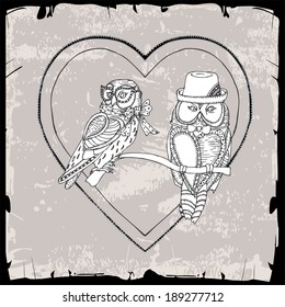 pair of owls in heart frame 