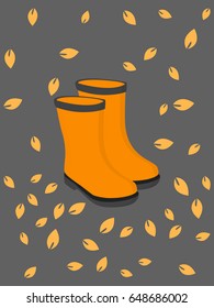A pair of rain rubber boots with autumn leaves decoration 
