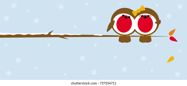 pair of robins perched on a branch in winter with snow and leaves falling