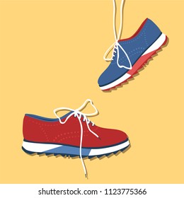 pair of shoes on yellow background