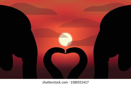 A pair of silhouettes of elephants forming a heart with a red sunset sky background