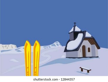 A pair of skis and a chapel in the mountains