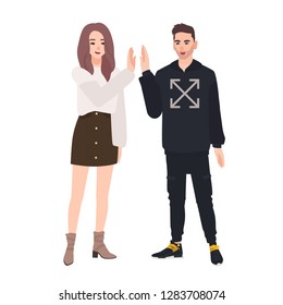 Pair of smiling young man and woman dressed in casual clothes giving high five. Teenage boy and girl greeting each other. Happy friends meeting. Colorful vector illustration in flat cartoon style.