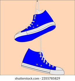 a pair of sneakers hanging on laces