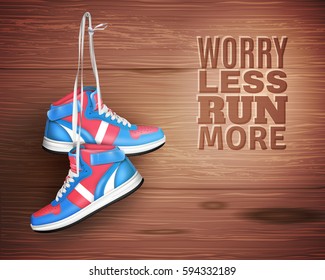 Pair of sports shoes hanging on nail in wood background with description worry less run more realistic vector illustration  