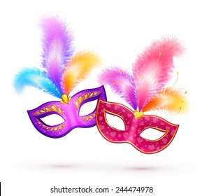 Pair of vector bright carnival masks with colorful feathers