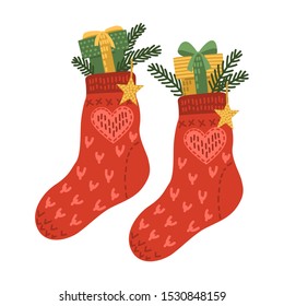 Pair of warm wool socks with Christmas gifts. Hand drawn Xmas celebration vector illustration