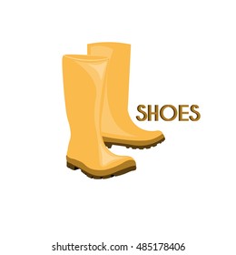 Pair of water resistant shoes, yellow rain boots on white