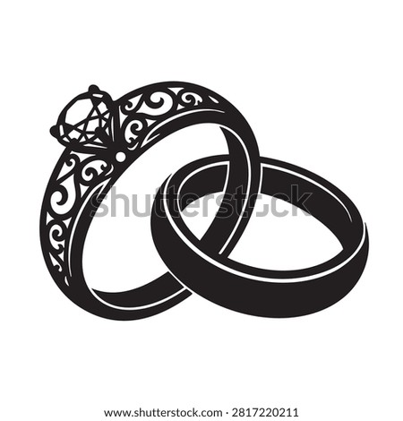 A pair of wedding rings symbolizing love and commitment. One ring features a detailed filigree design and a sparkling diamond, representing engagement and proposal. The other is a simple, elegant band. Together, they signify union, marriage, and eternal togetherness, perfect for romantic celebrations and special occasions.