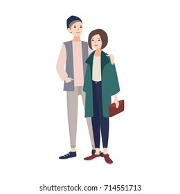 Pair of young man and woman dressed in stylish modern clothes standing together, smiling and embracing. Fashionable couple. Cartoon characters isolated on white background. Flat vector illustration.