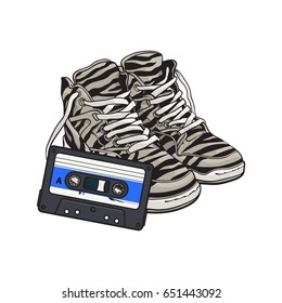 Pair of zebra sneakers and audio tape from 90s, retro style disco attributes, sketch vector illustration isolated on white background. Retro style sneakers and magnetic audio tape from nineties