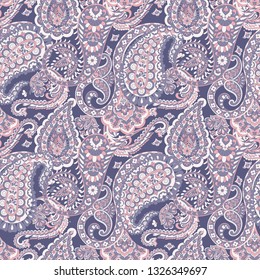 Paisley ethnic seamless pattern with floral elements.