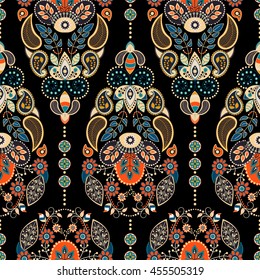 Paisley floral seamless pattern. Dark backdrop with indian decorative elements