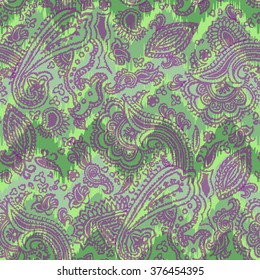 Paisley pattern on a zig zag ornament green color. Hand drawn painting ethnic background. translucent paisley elements on a geometric background.