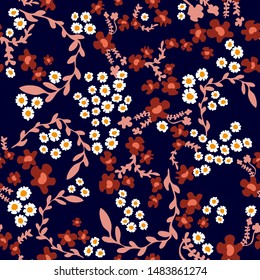 Paisley print with small daisies and wildflowers. Seamless vector pattern with Indian motifs. Summer textile collection.