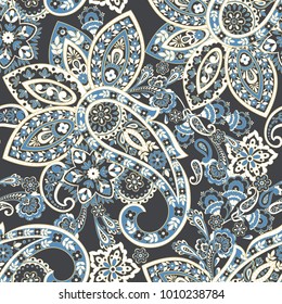 Paisley seamless pattern with flowers in indian style. 