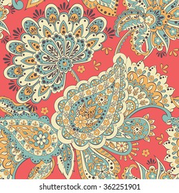 Paisley seamless pattern with flowers in indian style. Floral vector background