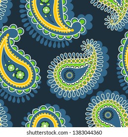 Paisley seamless pattern in green and yellow over dark blue background