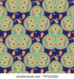Paisley seamless pattern. Vector floral dark blue arabesque background with colorful paisley flowers and ethnic tiled ornaments. Oriental design. Ornate tribal wallpaper. Ornamental fabric texture.