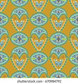 Paisley seamless pattern. Yellow floral background with colorful oriental paisley flowers and ethic beautiful abstract ornaments. Vector ornamental texture for fabrics, wallpapers, textile, prints.