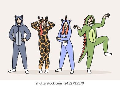 Pajama party for men and women in cute animal costumes for comfortable, restful sleep. Positive guys and girls prepared for masquerade on theme of pajama party, posing smiling in full length