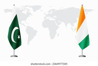 Pakistan and Ivory Coast flags for official meeting against background of world map.