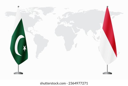 Pakistan and Monaco flags for official meeting against background of world map.