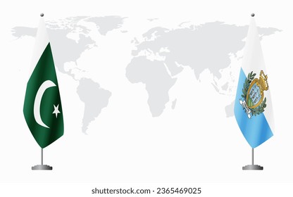 Pakistan and San Marino flags for official meeting against background of world map.